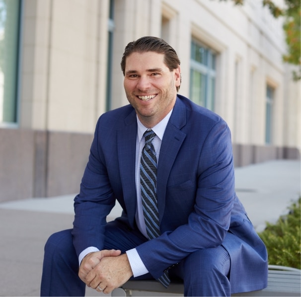 Christopher D. Burk sitting down smiling